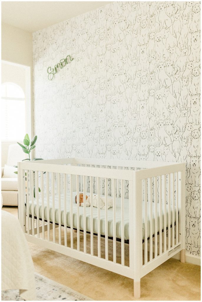 Baby naps in his crib during an in-home newborn session in Sacramento