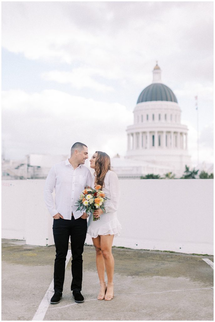 a couple looking at each other during their sacramento engagement session