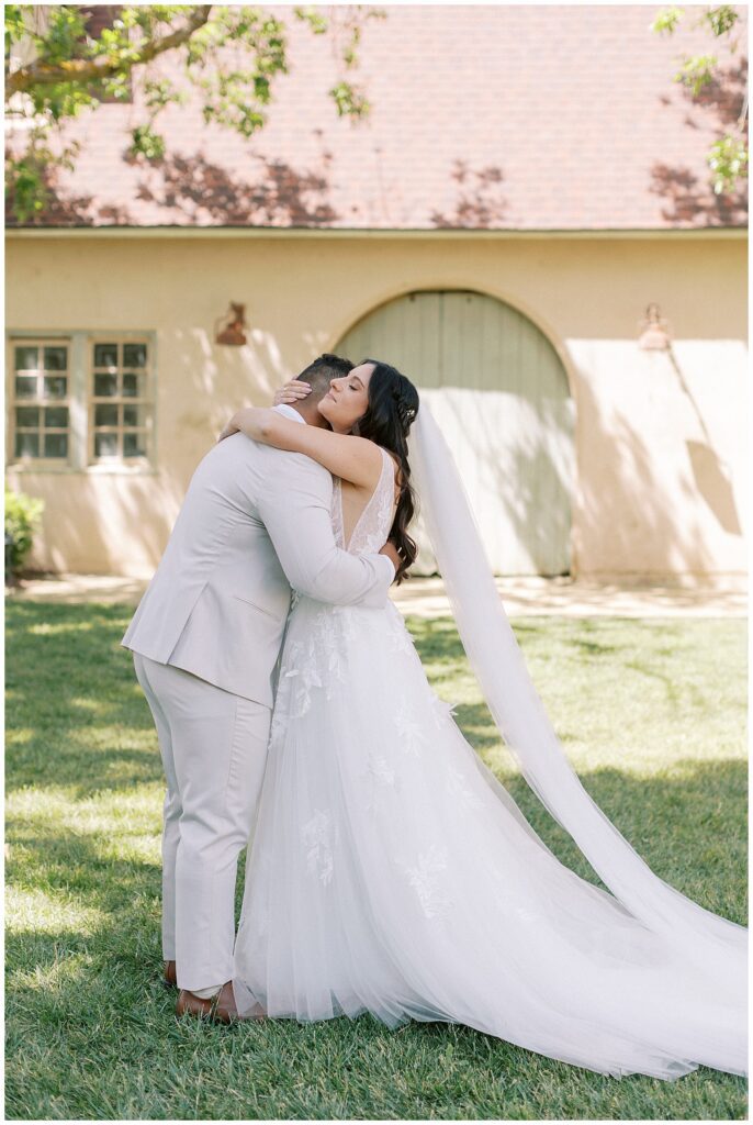 bride and groom hugging after their first look.